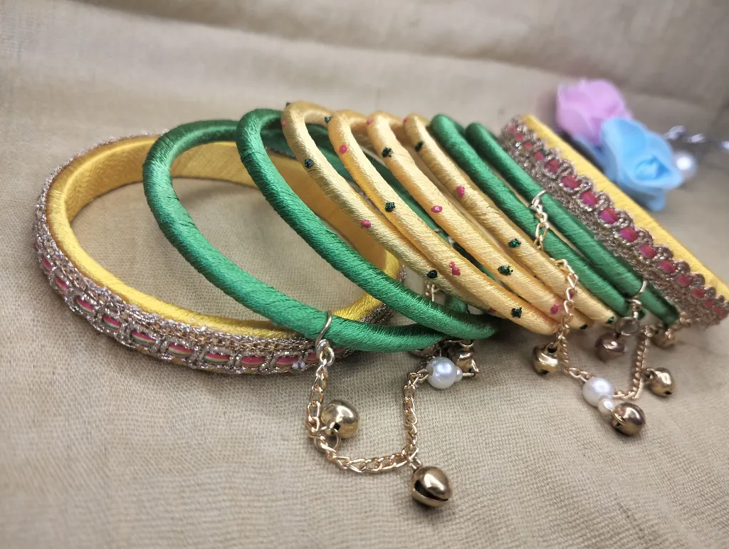 Golden Yellow & Emerald Green Thread Bangles with Pearl & Bell Charm Chain-PRISHAN-1.webp